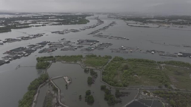 Aerial drone view of oyster farming rafts on the river in Long Son, near Ho Chi Minh City, Vietnam.
