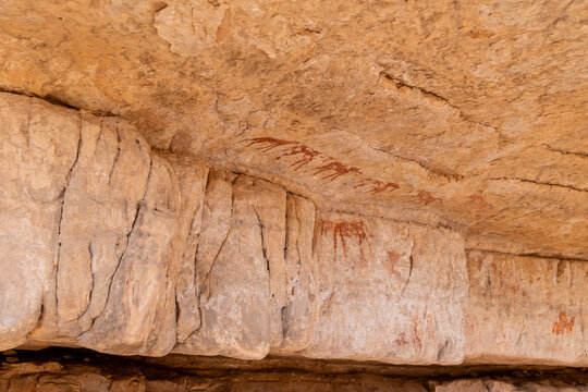 Weathered Rock Art on Sandstone Wall