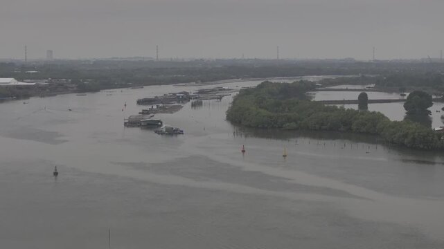 Aerial drone footage of oyster farming in Long Son, Ho Chi Minh City, Vietnam, showcasing traditional aquaculture, floating oyster farms, coastal fishing industry and sustainable seafood production.