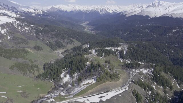 A drone video of the Caucasus Mountains, the Dzhily‑Su Valley, and the Pkhia Pass, Arkhyz, Russia, 2026.

