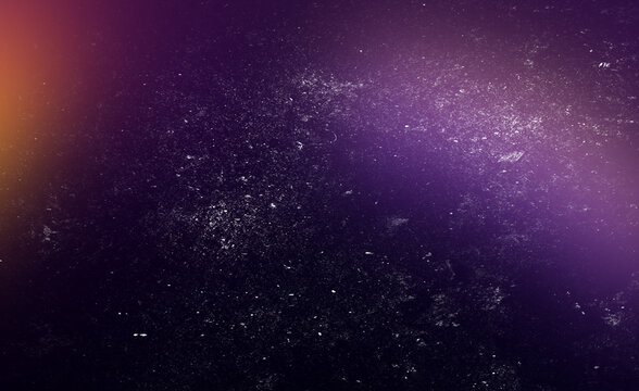 Cosmic purple background with diagonal light leak and white dust particles creating outer space aesthetic for futuristic design projects and atmospheric digital photography overlays.
