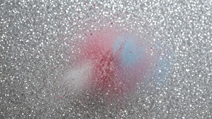 Fototapeta premium Sparkling glitter background with pink and blue powder explosion effect.