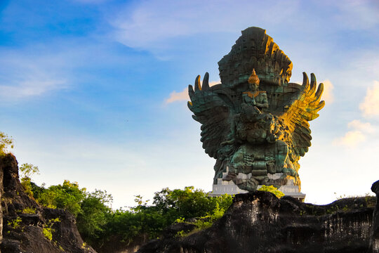 Towering GWK Monument Set Against Dark Rock Formations