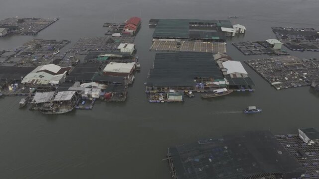 Aerial drone view of oyster farming rafts on the river in Long Son, near Ho Chi Minh City, Vietnam.