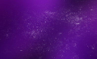 Abstract purple grainy background with heavy dust textures and retro film noise effect featuring deep violet gradients and scattered white specks for creative vintage design projects.