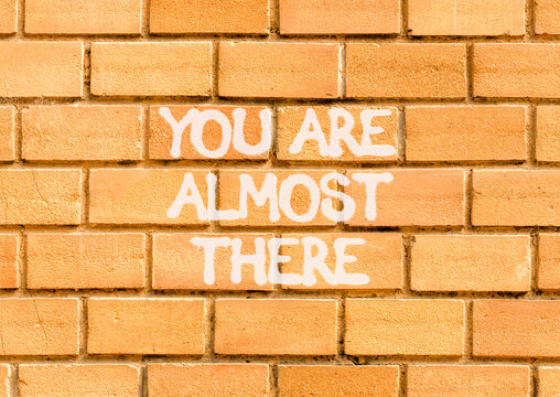 You are almost there words symbol. Concept words You are almost there on beautiful brick wall. Beautiful brick wall background. Business You are almost there motivational support concept. Copy space.