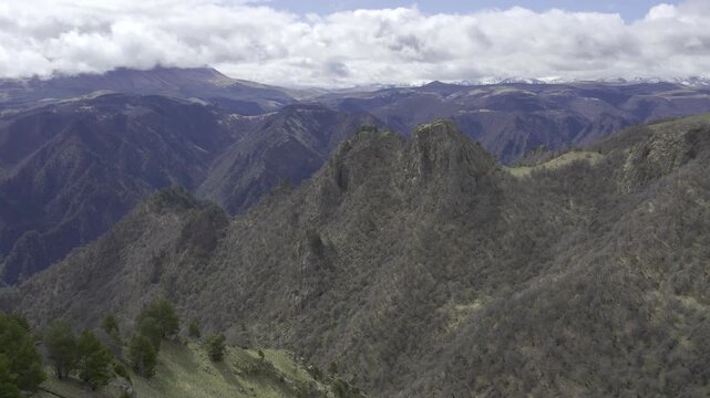 A drone video of the Caucasus Mountains, the Dzhily‑Su Valley, and the Pkhia Pass, Arkhyz, Russia, 2026.

