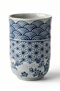 Traditional Japanese Ceramic Yunomi Tea Cup with Seigaiha and Asanoha Pattern Isolated on White