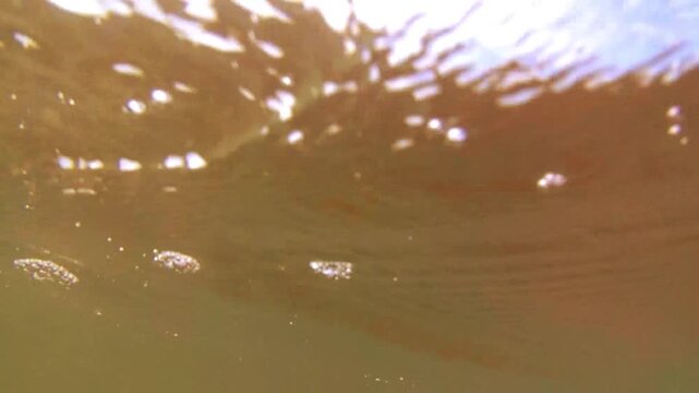 sea ​​water splashes against the camera lens