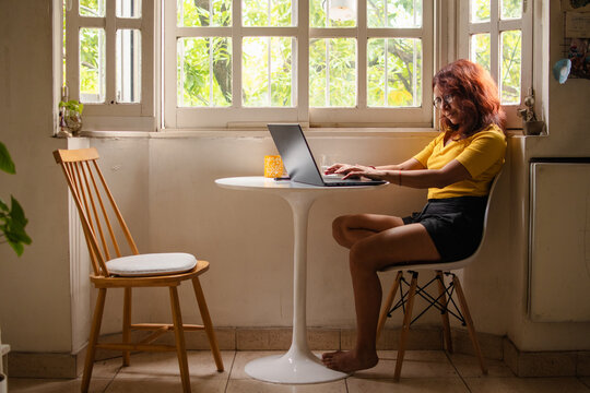 Woman using laptop at home