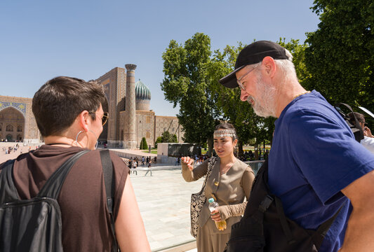 Tourists Listening to a Guide at Registan Square