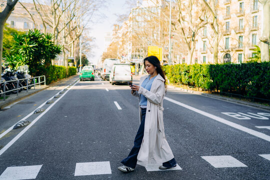 A woman using a mobile phone in the city