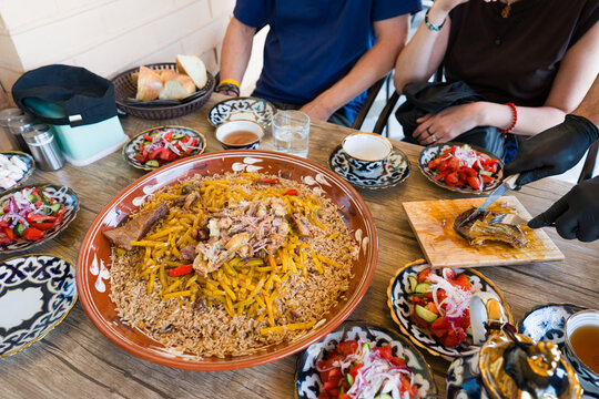 Gathering Around Pilaf at a Dining Table in Samarkand, Uzbekistan