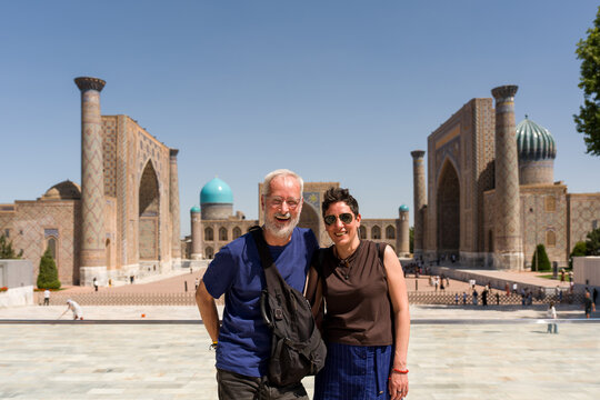 Couple Stands in Front of Registan Square in Samarkand
