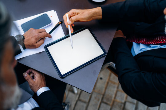 Businessmen use a tablet with a white screen