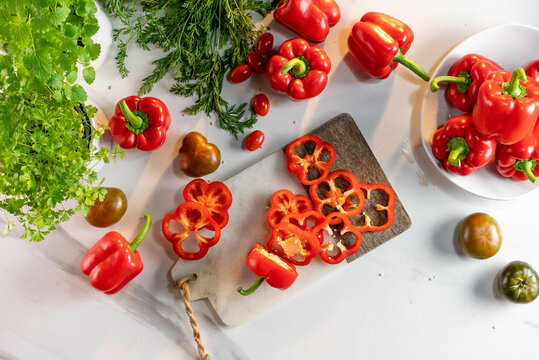 Cut red peppers on table