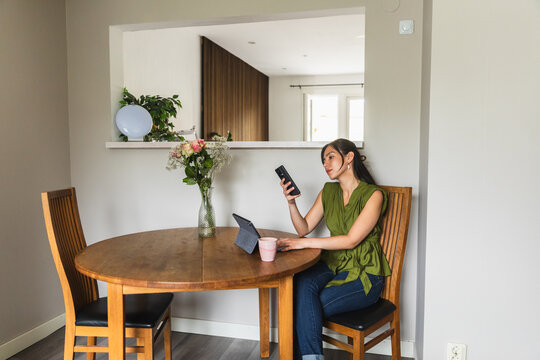 Female Freelancer Working on Laptop and Smartphone