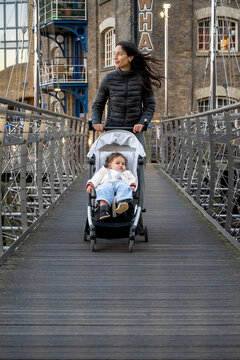 Mother Crossing Historic Bridge With Baby Girl During London Tourism 