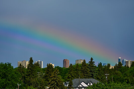 Rainbow Over Urban Skyline