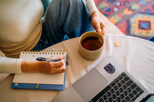 A woman using a laptop at home