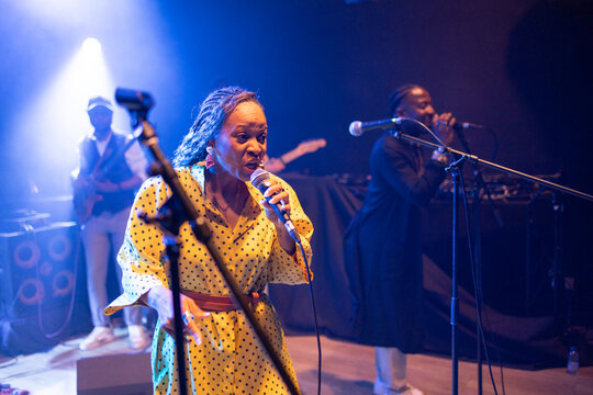 African american female singer performing spirited live music concert