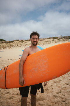 Man holding a surfboard 