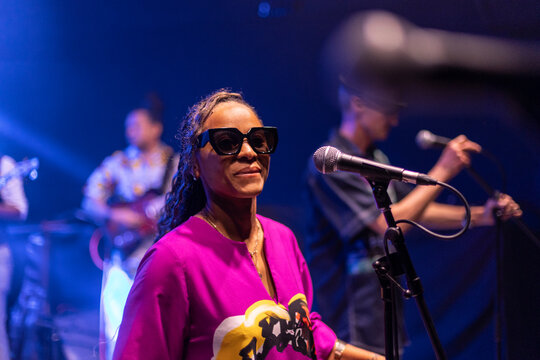 Woman singing performing live music on stage