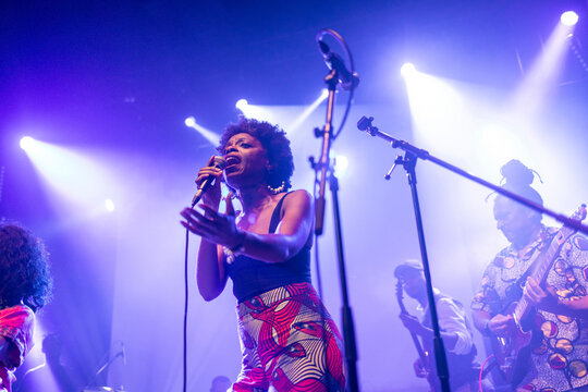 African american female vocalist singing on stage