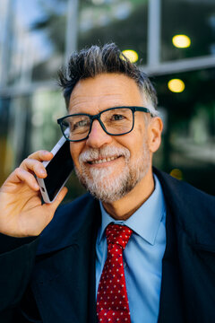 A man talking on a mobile phone in the city