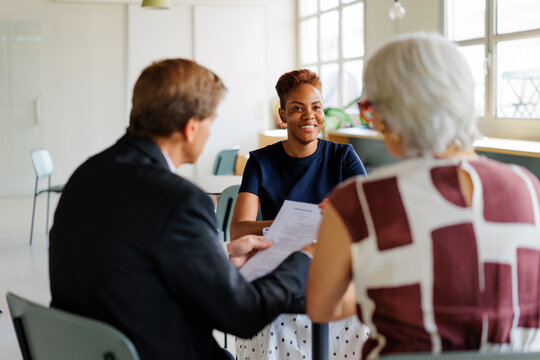 Applicant smiling during business interview with recruiters