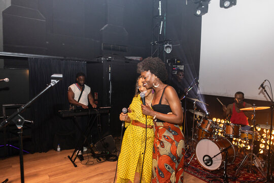 Women singers performing live jazz concert on stage