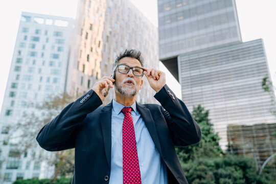 A man talking on a mobile phone in the city