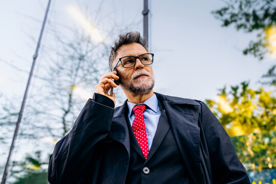 A man talking on a mobile phone in the city