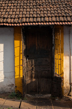 Vintage wooden entrance door of an old Portuguese-style house in Goa, India