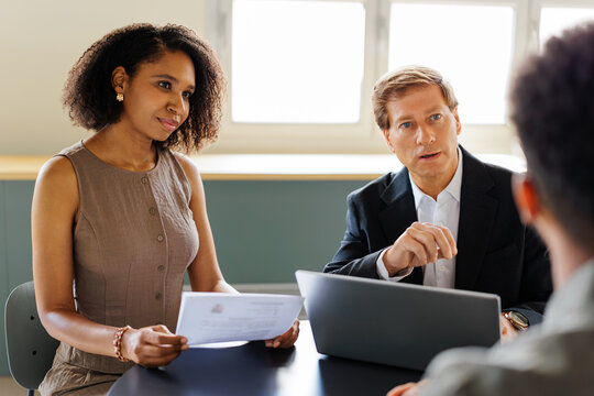 Professionals conducting a job interview