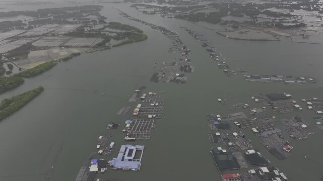 Aerial drone footage of oyster farming in Long Son, Ho Chi Minh City, Vietnam, showcasing traditional aquaculture, floating oyster farms, coastal fishing industry and sustainable seafood production.