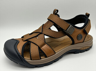 Naklejka premium Brown hiking sandal with velcro straps for outdoor activity. Summer footwear features durable sole, protective toe cap for walking travel. Comfortable athletic gear for men, women sits on white