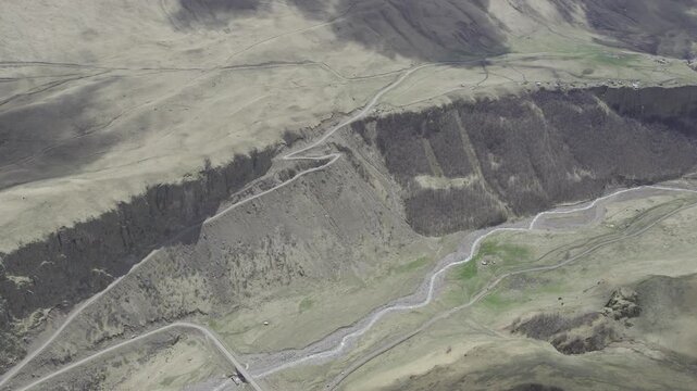 A drone video of the Caucasus Mountains, the Dzhily‑Su Valley, and the Pkhia Pass, Arkhyz, Russia, 2026.

