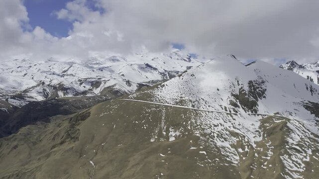 A drone video of the Caucasus Mountains, the Dzhily‑Su Valley, and the Pkhia Pass, Arkhyz, Russia, 2026.

