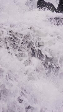 Multi-layered rock waterfall with white rapids rushing continuously