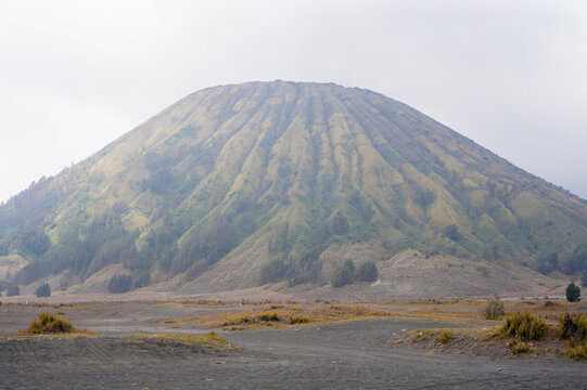 Iconic Mount Batok Cone-Shaped Volcanic Mountain Landscape at Bromo Tengger Semeru National Park