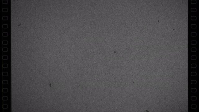 Vintage film grain texture overlay with authentic 16mm dust and scratches.