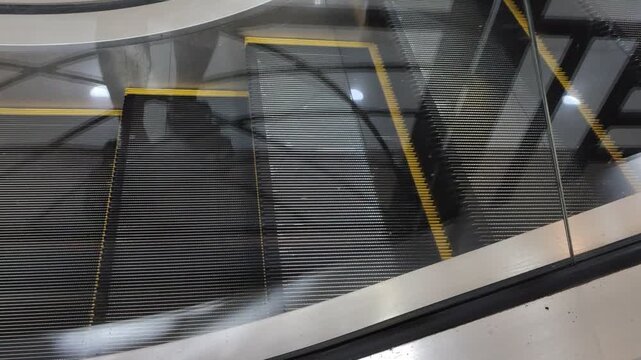 Close up view of moving escalator steps inside a clean contemporary building
