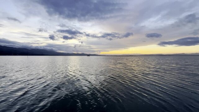 Calm Sea at Sunset with Cloudy Sky