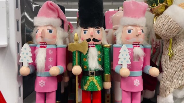 Close up of a Christmas nutcracker toy on a store shelf. Festive retail display showing holiday merchandise and traditional seasonal decor.