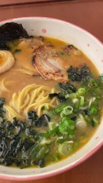 Traditional Japanese ramen noodle soup served in a restaurant