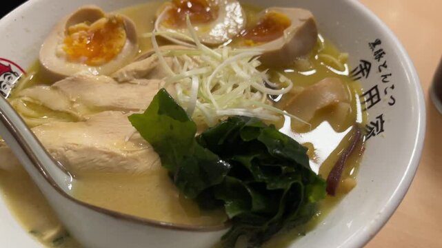 Traditional Japanese ramen noodle soup served in a restaurant