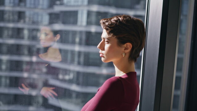 Pensive business woman looking window cityscape. Closeup portrait thoughtful