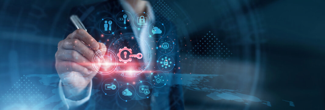 Identity security. System administrator using laptop configuring multi-factor authentication policies and role-based permissions dashboard on secure network terminal. Cybersecurity gateway.