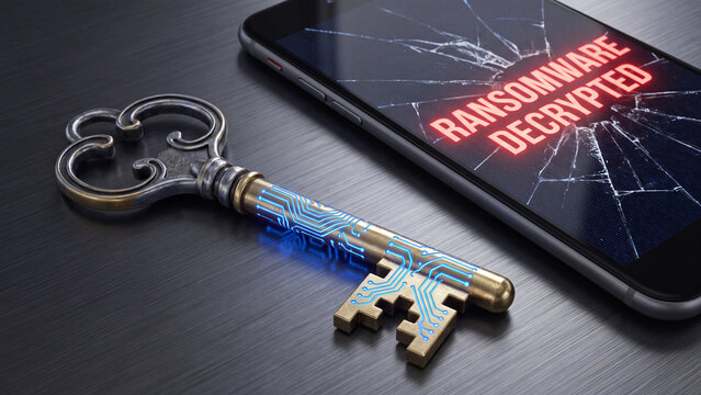 Key with circuit board patterns lies beside a smartphone screen displaying a ransomware decrypted notification.